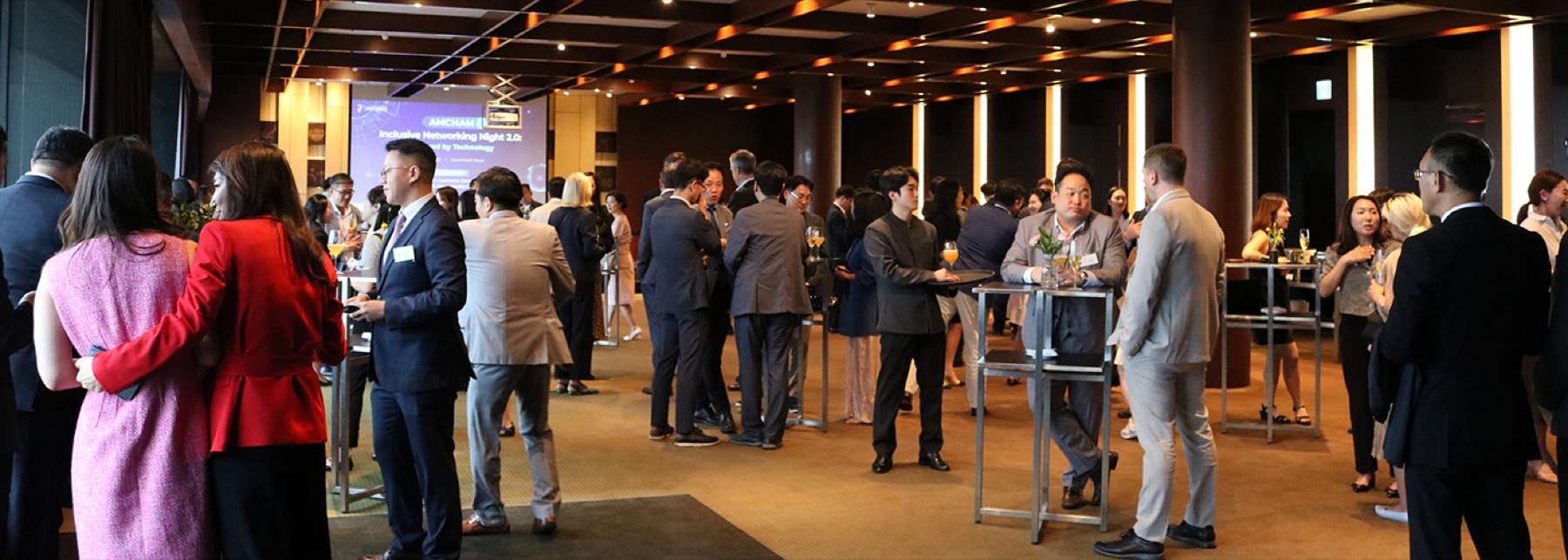 Members talking at an AMCHAM Korea networking reception